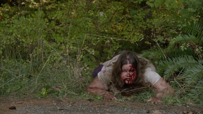 Miriam crawling out of woods