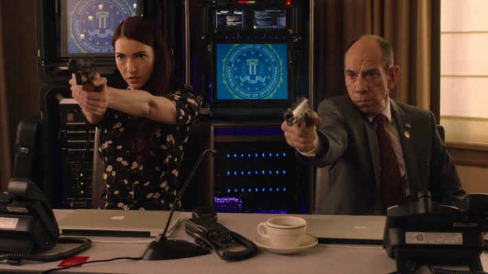 Agents with guns drawn