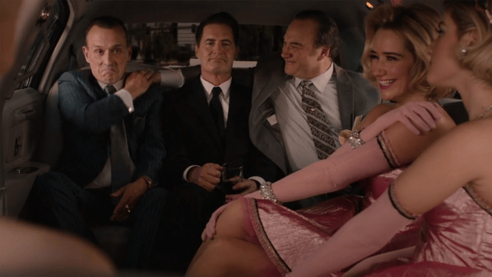 Coop and men in limo with women