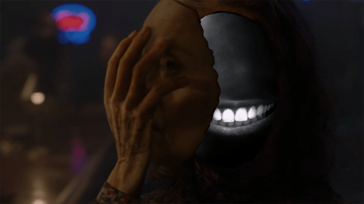 Sarah Palmer taking face off to reveal teeth